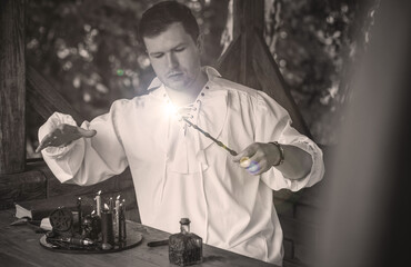 Man wizard with magical stuff. Halloween concept, masquerade or cosplay Medieval men's look