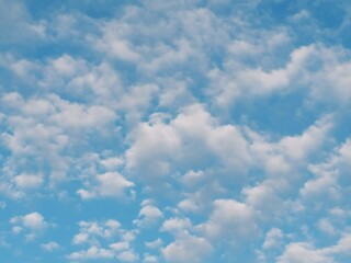 Full frame of pretty blue sky with pale white cloud formation