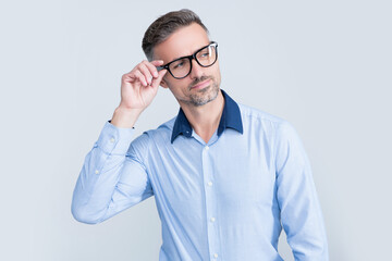 confident mature boss in office shirt wearing eyeglasses