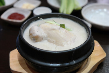 Korean traditional nutritious chicken dish stuffed with ginseng, jujube and glutinous rice and simmered until tender.