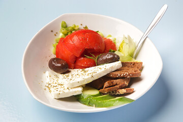 Greek salad, feta cheese with vegetabls and toast bread 
