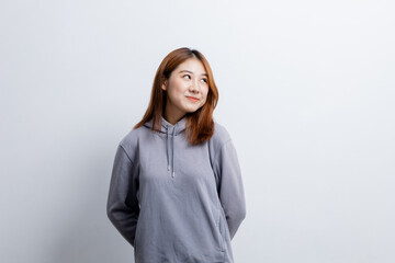 Beautiful Asian woman gesturing for advertisement editing on isolated background, portrait concept used for advertisement and signage, isolated over white background, copy space.