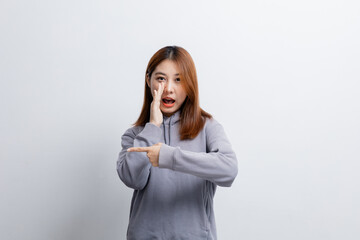 Beautiful Asian woman gesturing for advertisement editing on isolated background, portrait concept used for advertisement and signage, isolated over white background, copy space.