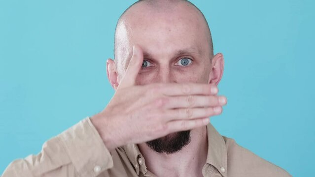 Mood swing. Bipolar emotion. Boomerang animation. Dual personality. Opposite character. Funny man changing sad happy face with sliding hand gif loop isolated on blue.