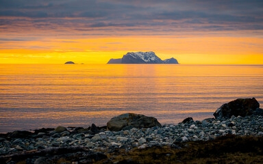 Fototapeta na wymiar Lyngstuva lighthouse during sunset or sunrise, Lyngen, Lyngenfjord, Troms og Finnmark, Norway
