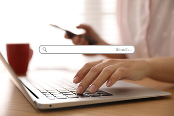 Fototapeta premium Search bar of website and woman working with laptop in office, closeup