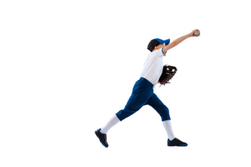 Fototapeta na wymiar Studio shot of sportive kid, beginner baseball player in sports uniform playing baseball isolated on white background. Concept of sport, achievements, competition
