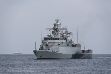 Fototapeta na wymiar BALTIC SEA - POLAND - GERMANY - 2022: A warship of the German Navy is sailing on sea