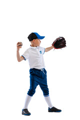 Little boy, baseball player, pitcher in blue-white uniform training isolated on white studio background. Concept of sport, achievements, studying, competition.
