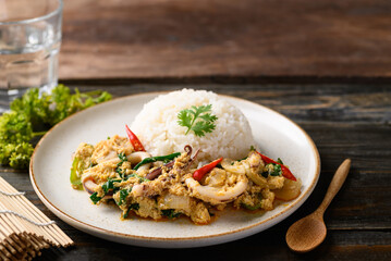 Thai stir fried curry squid and cooked rice, Thai food