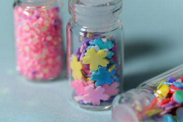 Glitter bottles for nail service, various nail design tools, glitter. Close-up, macro