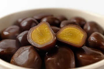 smoked quail eggs on a white background