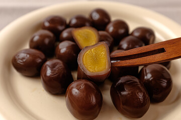 Salty and chewy smoked quail eggs