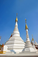 Fototapeta premium Group of Gorgeous Mon Style Pagoda or Phra Mu Tao in Wat Chomphuwek Historic Buddhist Temple, Nonthaburi Province, Thailand