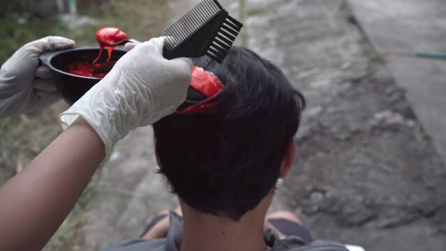 Man changing hair coloring. Beauty concept, hair care.