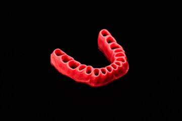 human gums without teeth model medical implant isolated on black background. Healthy teeth, dental care and orthodontic concept.