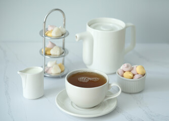 Green tea, Sweets, teapot, milk, on a white background