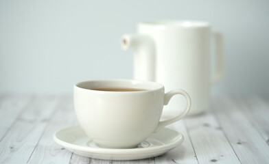 Tea time. Cup of tea with a teapot.	