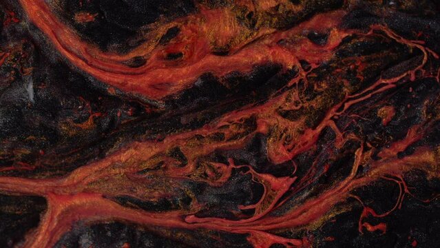 Fluid art. Abstract background with effect dramatic eruption volcano.Smartphone wallpaper or theme. Landscape of movement lava. Liquid texture motion with orange and black colors.
