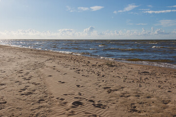 Sandy beach and Baltic sea during sunny day
