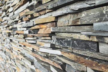 Closeup shot of stockpile of rough dry wooden planks.