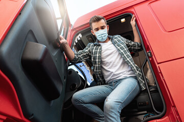 Young truck driver wearing protective mask
