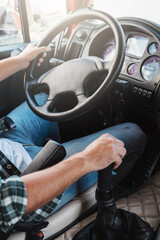 Naklejka premium Male truck driver driving his big vehicle