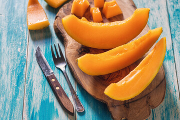 Sliced ripe melon on a cutting board 