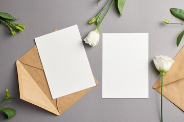Wedding invitation card mockup with envelope and white eustoma flowers