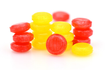 Pile of lozenges candy on white background.