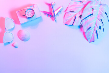 Creative layout with copy space and various summer objects on pastel turquoise background. Minimal vacation concept. Flat lay.