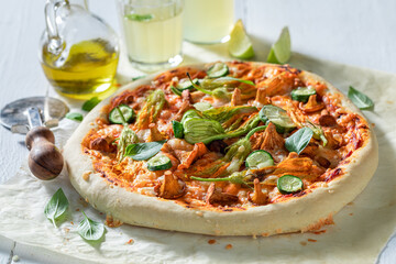 Hot pizza made of wild mushrooms and zucchini flower