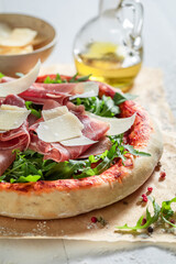 Healthy pizza Parma with parma ham and parmesan cheese.