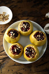 Traditional homemade baked apples with fruits and nuts