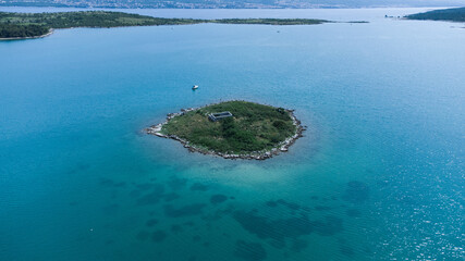 Island at the adriatic sea. In Krka island bay. Drone view. Croatia