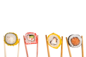 chopsticks hold different rolls on a white isolated background