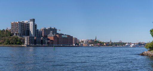 Obraz premium The apartment houses at the pier Kvarnholmen in the district Nacka a sunny summer day in Stockholm 