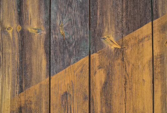 background old gray wood with shabby paint, with gaps between boards, knots. Weathered and faded natural wood with lines of boards, with space for text
