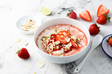 Homemade porridge with strawberry and almond
