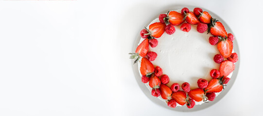 Delicious biscuit cake with cream cheese and berries. Light cake with strawberries and raspberries....