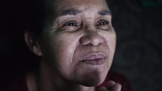 One older hispanic black woman portrait face closeup. A senior South American elder