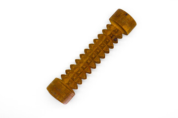 A picture of wooden massage roller on white background with selective focus