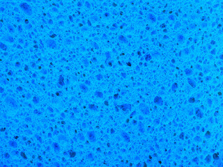 Abstract texture from the surface of a blue washing sponge