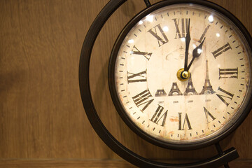 Old paris eifel tower Clock on wooden background