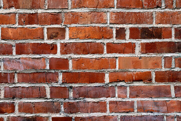 Naklejka premium A closeup of a wall made of red bricks.