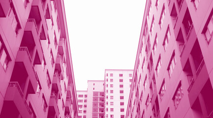 Surreal Pop Art Style Low Angle View of Modern High Buildings in French Rose Pink Color