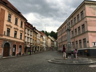 Street, square and old houses in the historical part of the city of Ljubljana.