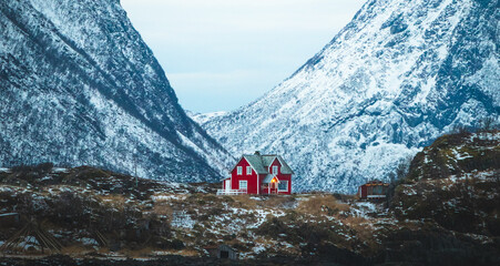 Small isolated Red house in Norway.  Feelings of peaceful and calm. Snowy Mountain house