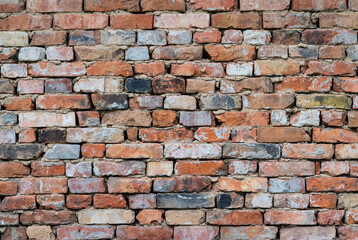 Fototapeta premium Background of old bricks. Colored bricks.