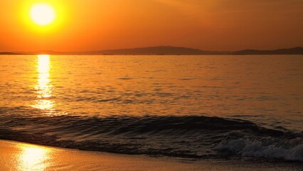 The sun setting in the sea